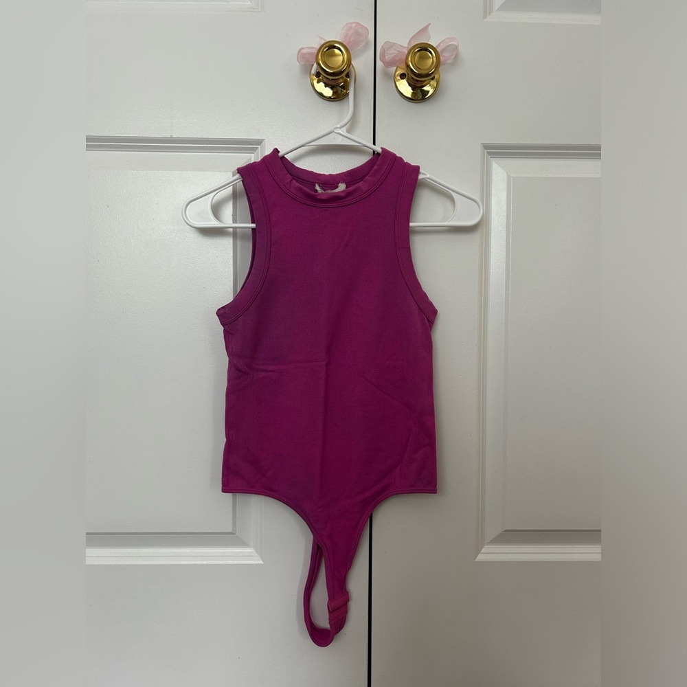 Pictures don’t look amazing. Pink tank top bodysuit. Brand Happily Grey.